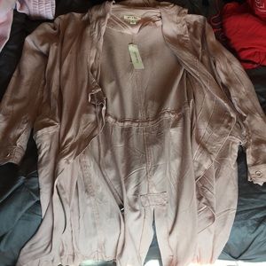 Francesca’s light pink trench coat